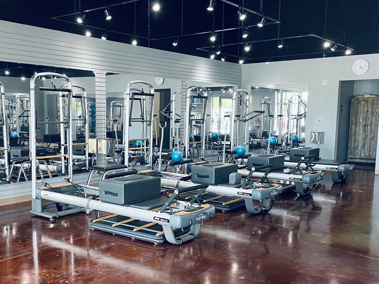 Wall-Mounted Glassless Mirrors in Pilates Studio