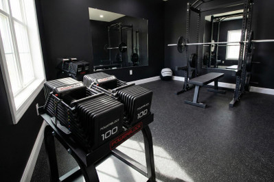 Compact Adjustable Dumbbells in Home Gym