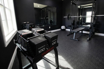 Compact Adjustable Dumbbells in Home Gym