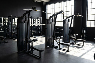 Commercial Lat Pulldown and Seated Row Machines in Gym