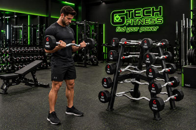 Man Training with a Gym Fixed Barbell in a Commercial Fitness Center