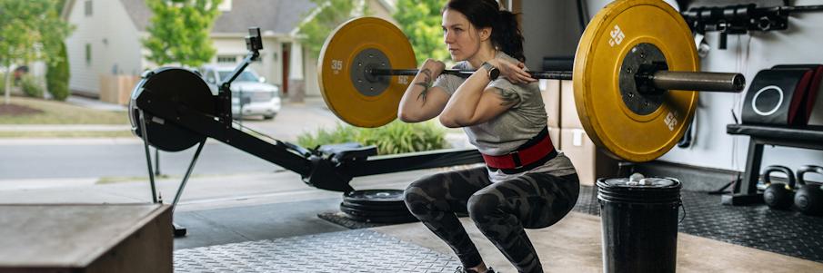 Woman Working Out in Garage Gym