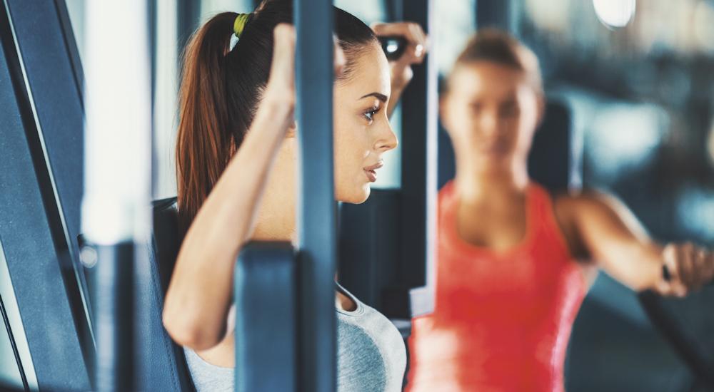 Women on Gym Weight Machines
